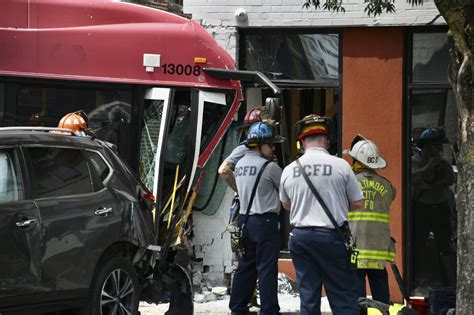 15 injured as Baltimore bus crashes into 2 cars, building